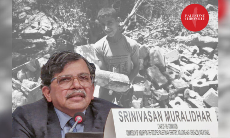 Srinivasan Muralidhar, chief of the UN Independent International Commission of Inquiry, speaks at a UN event, with an image of a Palestinian child standing amid rubble in Gaza in the background.