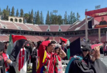Stanford graduates carrying Palestinian flags walk out during Google CEO Sundar Pichai's commencement speech.