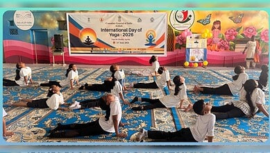 Students performing yoga during International Day of Yoga 2026 celebration at Indian school in Abha.