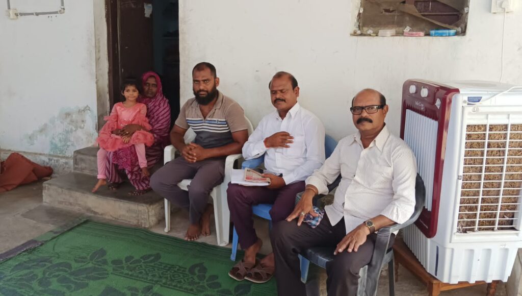 Swadesh Parikipandla meets the family of Dubai crash victim Abdul Rafiq at their residence in Kadem, with Rafiq's wife and daughter seated in the doorway.