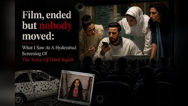 Audience watching The Voice Of Hind Rajab screening in Hyderabad with a poster and a photo of a girl.