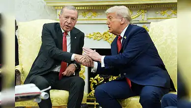 US President Donald Trump shakes hands with Turkish President Recep Tayyip Erdogan during a meeting at the White House.