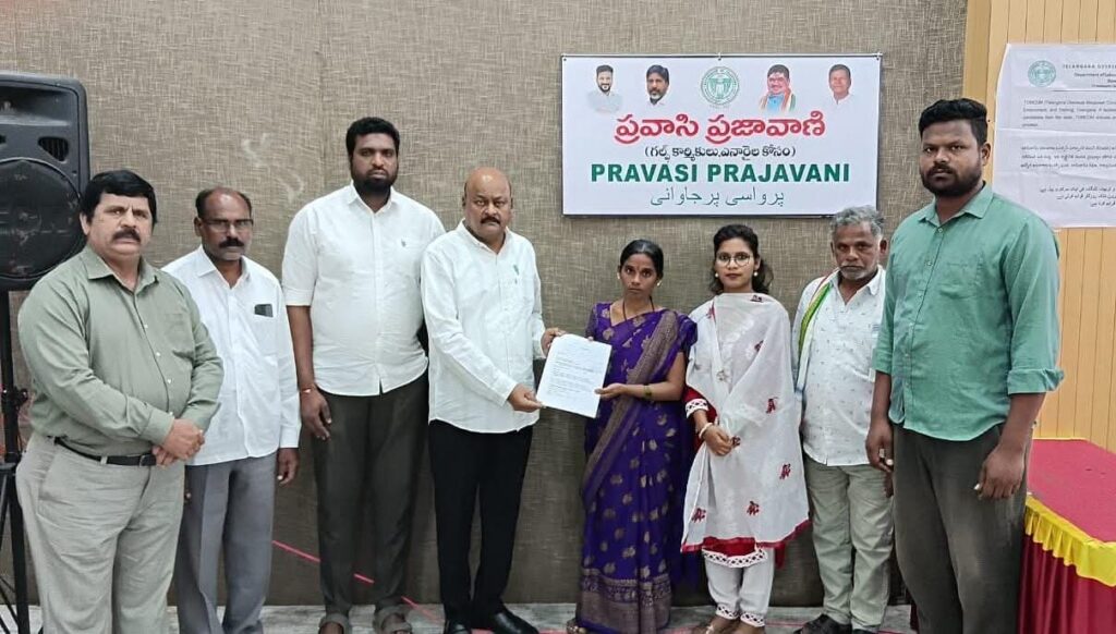 Veppugonda Rama hands a petition to Mandha Bheem Reddy at the CM Pravasi Prajavani programme in Hyderabad.
