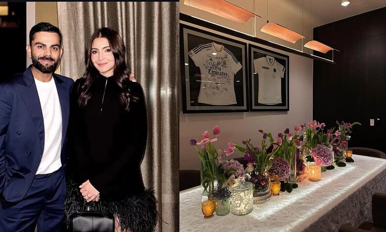 A woman and a man in formal attire standing in front of a decorated table with flowers and framed jerseys.