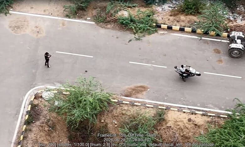 Drone captures risky bike stunts on Hyderabad road, with police monitoring the scene.