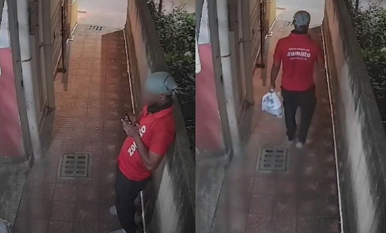 Zomato rider in red uniform leaving after marking order delivered, captured on CCTV footage.