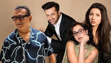 Four diverse individuals smiling and posing together in a studio setting.
