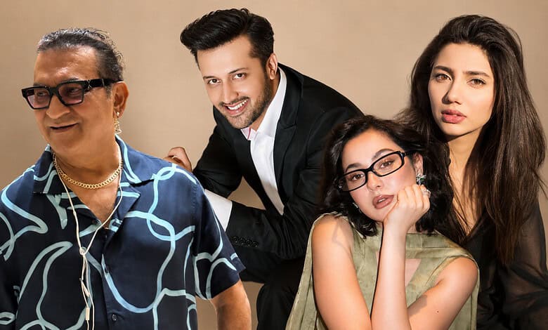 Four diverse individuals smiling and posing together in a studio setting.