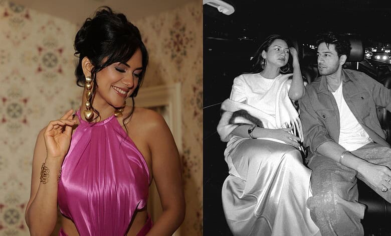Akanksha Chamola in a pink dress smiling with earrings, celebrating her identity.