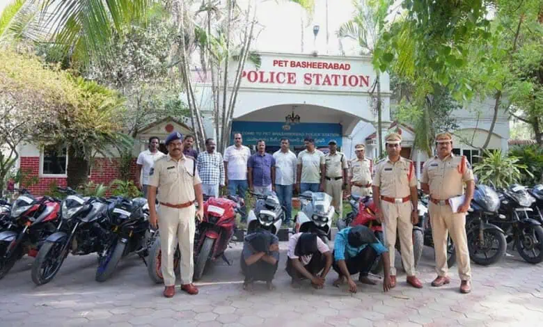 Police officers with seized bikes outside Cyberabad police station in Hyderabad.