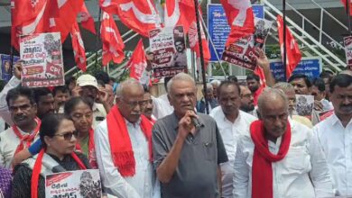 CPI leaders protest in Hyderabad over NEET paper leak with banners and red flags.