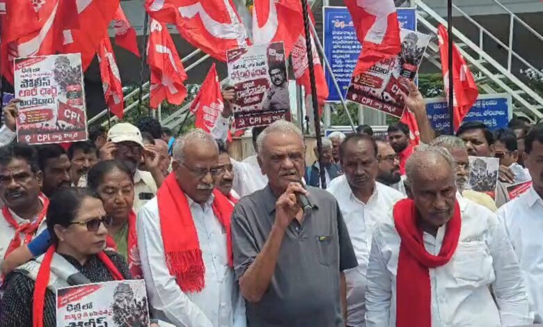 CPI leaders protest in Hyderabad over NEET paper leak with banners and red flags.