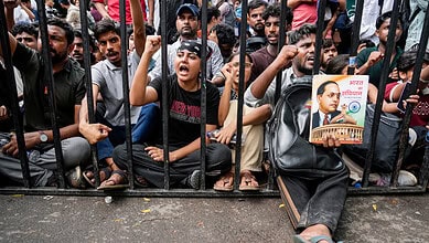 Cockroach Janata Party supporters raise slogans as they stage a protest demanding the resignation of Union Education Minister Dharmendra Pradhan, , a day after police action on students during the