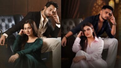 Two couples in stylish outfits sitting on a black leather sofa in a luxurious setting.
