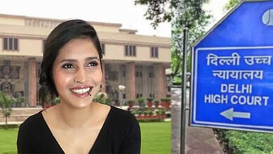 Smiling woman outside Delhi High Court with court building in background.
