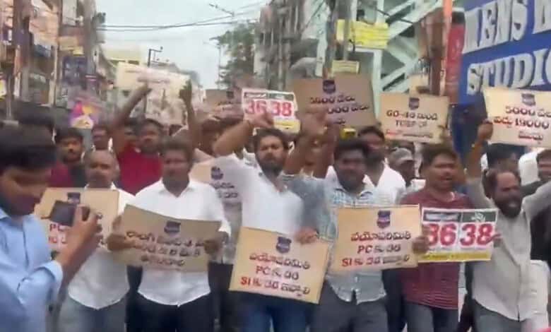Youth protest in Dilsukhnagar demanding 20K police jobs, holding placards and banners.