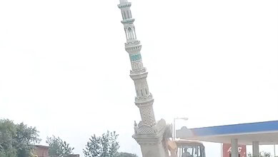A crane demolishes an illegal Eidgah structure in Sambhal, Uttar Pradesh, amid government action.