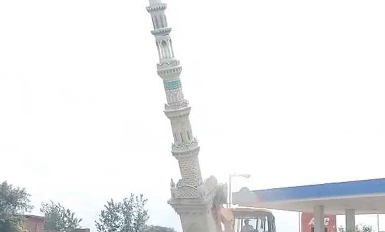 A crane demolishes an illegal Eidgah structure in Sambhal, Uttar Pradesh, amid government action.