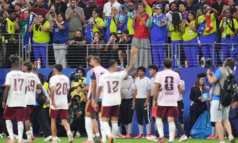 Celebrating football players and fans after a match at the FIFA World Cup.