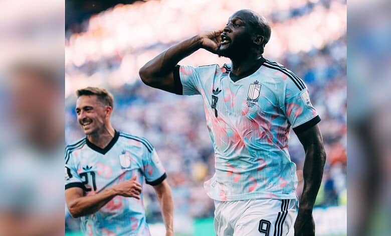 Argentinian footballer celebrating during a match, wearing light blue and white jersey with number 7.