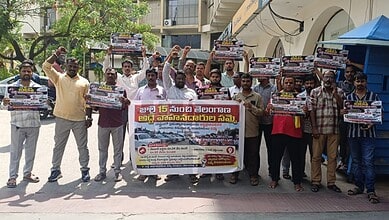 Drivers protesting for government hire vehicle issues in Telangana, holding placards and banners.