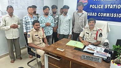 Police officers and suspects in Hyderabad gambling den bust, Attapur, Telangana.