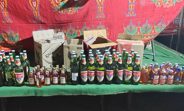 Seized liquor bottles and vehicles displayed during Hyderabad police CASO drive.