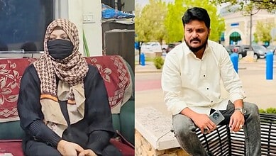 Two individuals, a woman wearing a hijab and face mask, and a man sitting outdoors, in Hyderabad.