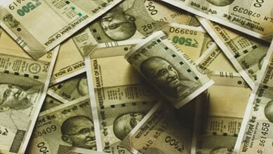 Close-up of counterfeit Rs 500 notes with Mahatma Gandhi's image, used in illegal printing.