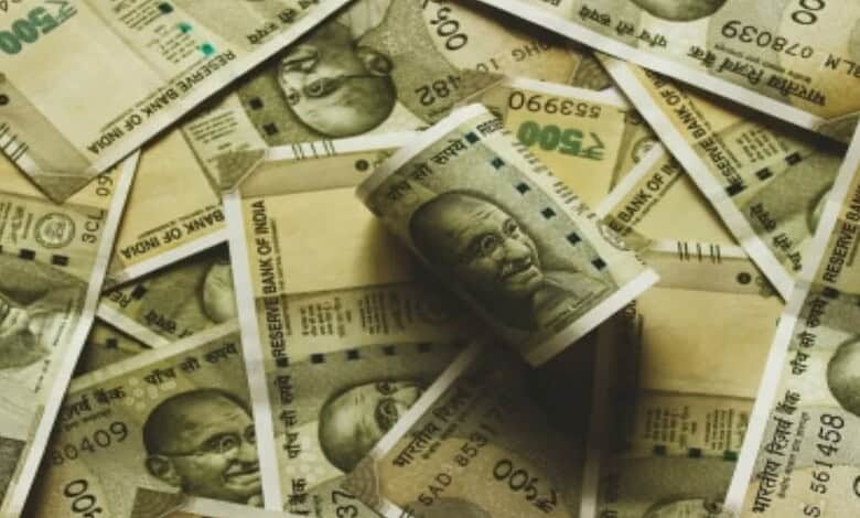 Close-up of counterfeit Rs 500 notes with Mahatma Gandhi's image, used in illegal printing.