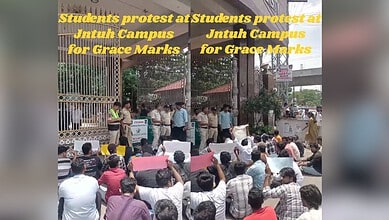 Students protesting over grace marks at JNTU Hyderabad campus, holding banners and placards.