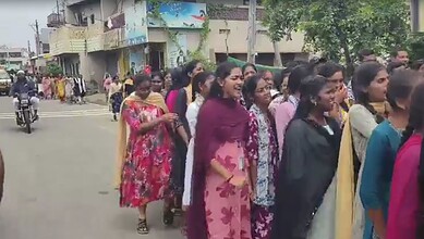 Students protesting with smiles and concern over lack toilets and water facilities at JNTUH Mahbubabad.