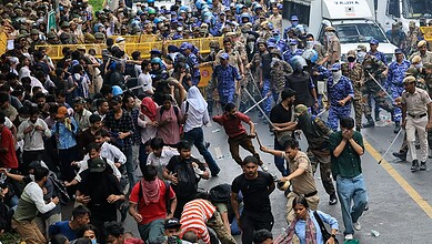 Protesters clash with police during NEET protest, police use force to control crowd.