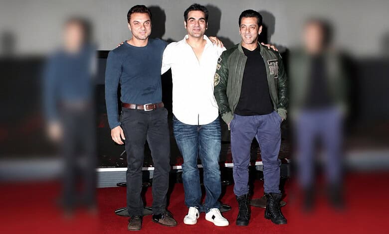Sohail Khan with his brothers Arbaaz Khan and Salman Khan at a public event.