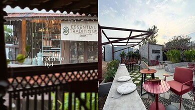 Rooftop cafe in Hyderabad with seating area and greenery during monsoon.