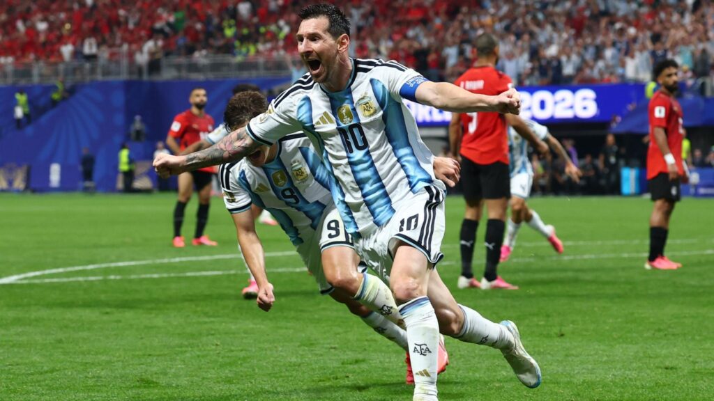 Lionel Messi celebrating a goal in Argentina's football match at the 2022 FIFA World Cup.