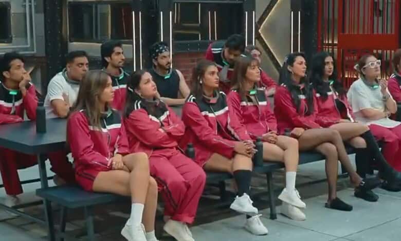 Group of contestants in red tracksuits sitting in a row during Lock Upp 2.