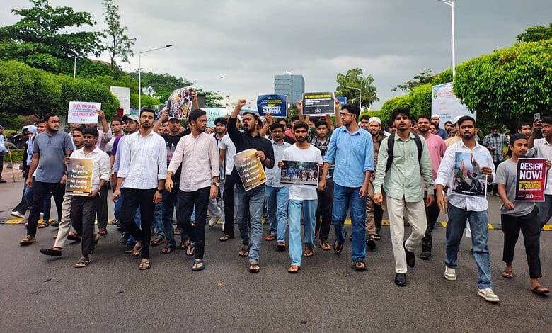 Students protest against Jauhar University demolition in Hyderabad, holding placards and banners.
