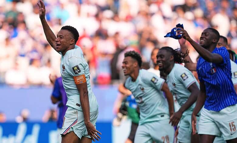French football players celebrating during a match at the FIFA World Cup.