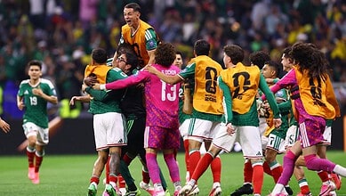 Mexican and Ecuadorian football players celebrate after a match at the FIFA World Cup.