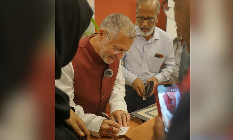 Mughal period example of religious pluralism: Michael Calabria signing a document with diverse scholars.