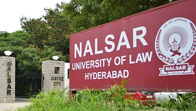 NALSAR University of Law Hyderabad entrance with greenery and justice city sign.