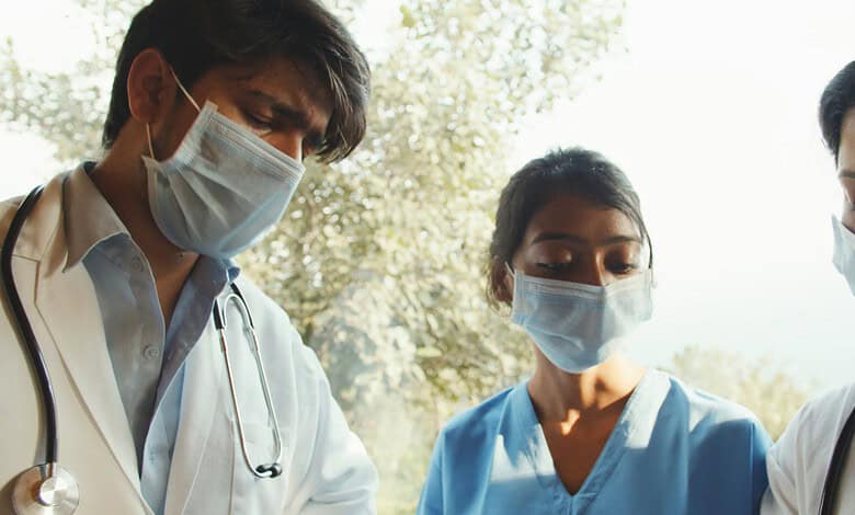 Hyderabad medics wearing masks emphasize safety measures on National Doctors Day.