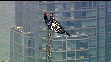 Couple atop the Empire State Building antenna