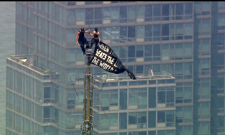 Couple atop the Empire State Building antenna
