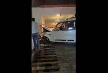 Car crash at actor Dharma's house in Hyderabad's Filmnagar, showing a damaged white vehicle inside a home.