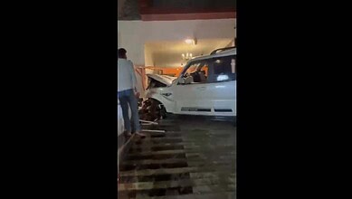 Car crash at actor Dharma's house in Hyderabad's Filmnagar, showing a damaged white vehicle inside a home.