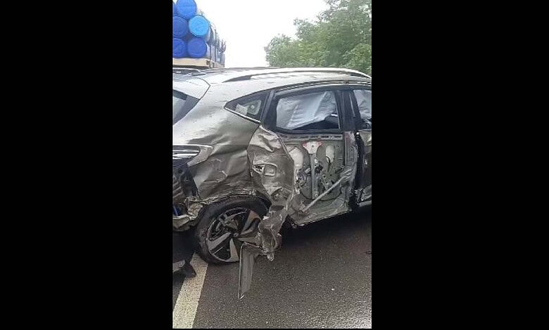 Damaged grey car after accident on Hyderabad's ORR, with visible side impact and crumpled bodywork.