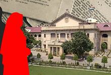 Silhouette of a man and woman in front of a grand historic building with trees and a lawn.