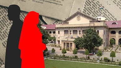 Silhouette of a man and woman in front of a grand historic building with trees and a lawn.